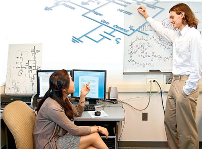 Yue (Luna) Yuan ’12 (left) and Felix Hutchison ’12 designed an artificial neuron — a portion of their full circuit schematic shown here — that mimics a key feature of the brain.