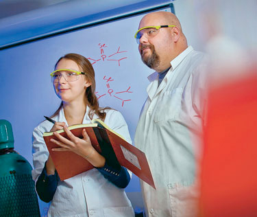 Chelsea Mandell ’12 (left) and Chip Nataro, associate professor of chemistry.