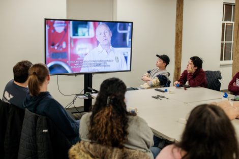 Student emergency medical technicians watch a video as part of their training.