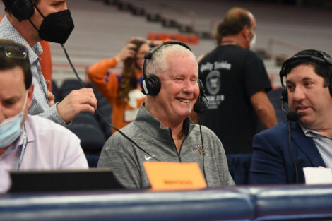 Fran O’Hanlon smiles sitting at a table with headphones
