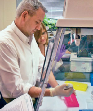 Carmen Marsit ’00 (left), assistant professor of pharmacology and toxicology, works with doctoral student Corina Lesseur- Perez in his lab at Dartmouth medical school.