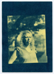 Janine Block stands with a tree behind her