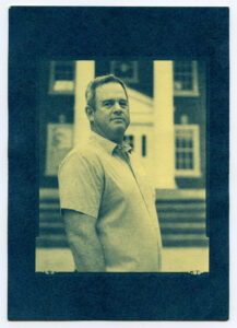 Josh Sanborn stands in front of a building with columns
